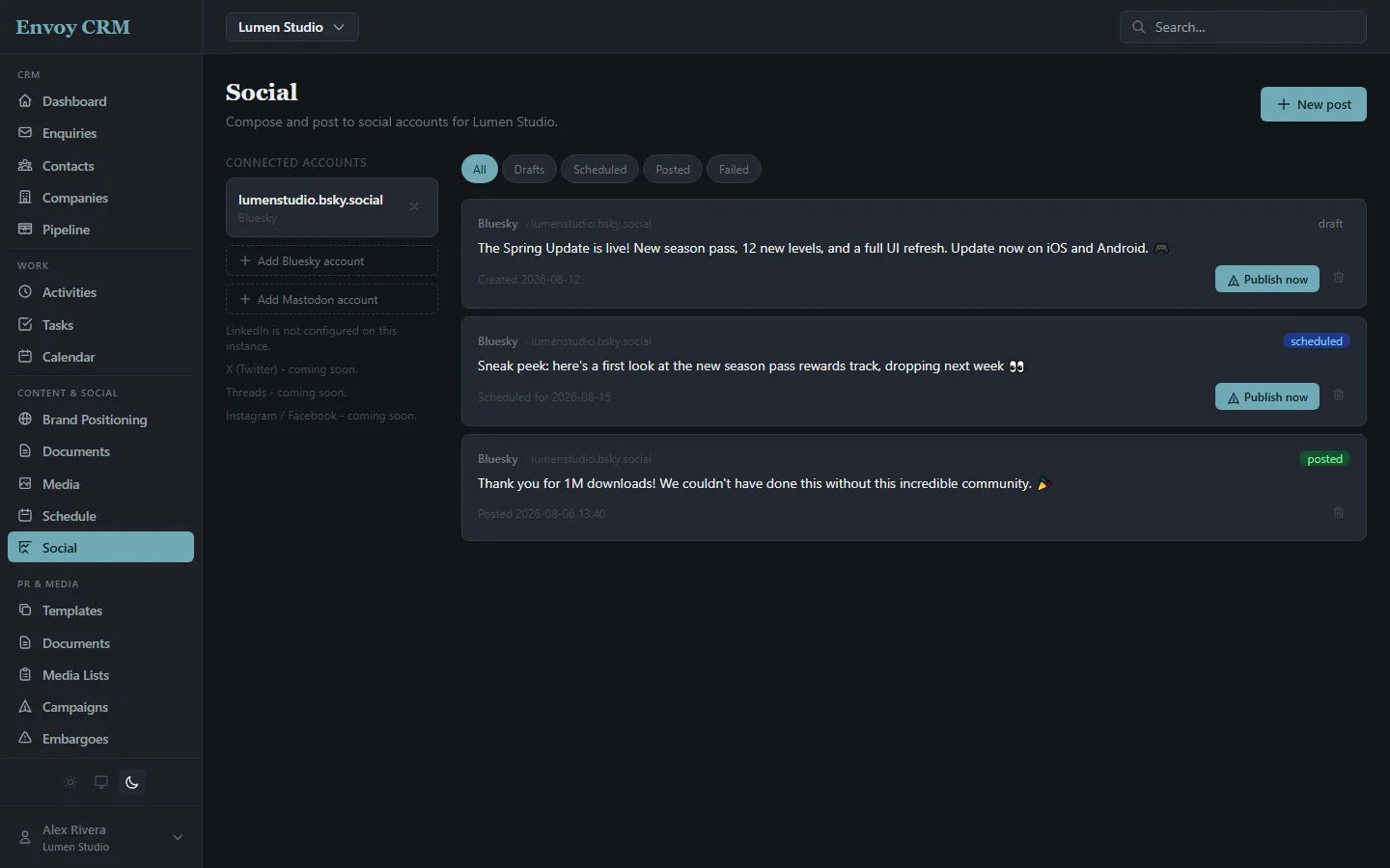 The Social page showing a draft, a scheduled post, and a posted update to a connected Bluesky account